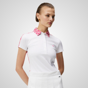 Model wearing J.Lindeberg Ladies Cara White Golf Polo Shirt